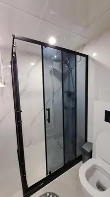 a glass shower in a bathroom with a toilet at Apart Viki in Sandanski