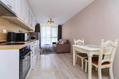 a kitchen with a table and a dining room at LDV 13 1-Bedroom Apartments Free private parking in Plovdiv