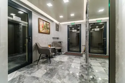 a waiting room with a table and chairs at LDV 13 1-Bedroom Apartments Free private parking in Plovdiv