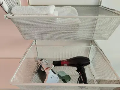 a wire rack with a hair dryer and a blow dryer at My Campus Studios, free parking, self-check in in Sofia