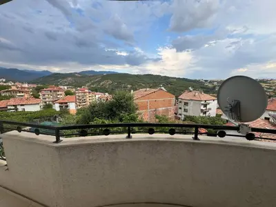 a balcony with a view of a city at Пандова къща in Sandanski