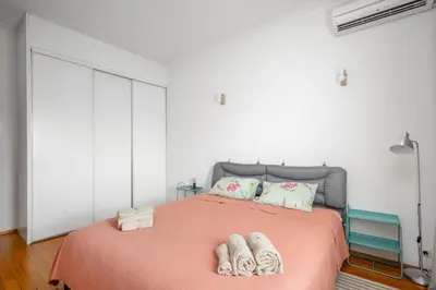 a bedroom with a bed with towels on it at Charming 2BD Apartment in the Heart of the City by Flat Mаnager in Sofia