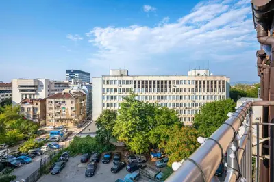 a view of a city with cars parked in a parking lot at Spacious 2BD Flat with Secure Free Parking by Flat Mаnager in Sofia