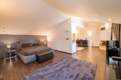 a bedroom with a bed and a living room at Villa 1331 in Zheleznitsa