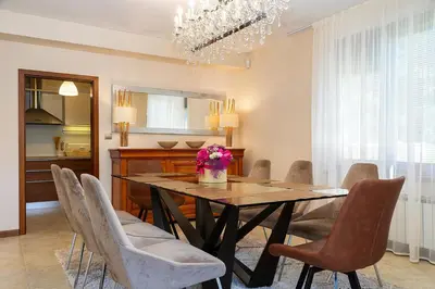a dining room with a table and chairs at Villa 1331 in Zheleznitsa
