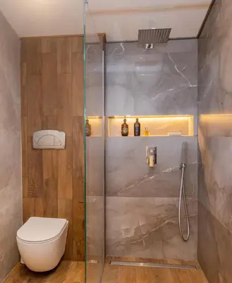 a bathroom with a toilet and a glass shower at Villa 1331 in Zheleznitsa