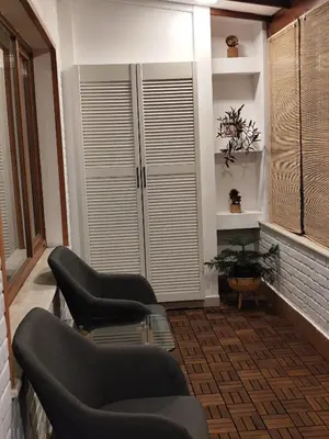 a living room with two chairs and a couch at Only You Boutique Apartment in Sofia