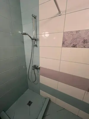 a bathroom with a shower with a glass door at Уютен тристаен апаратамент,намиращ се на тиха и спокойна улица in Sofia