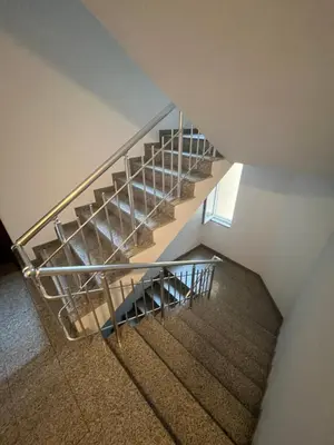 an overhead view of a staircase with a metal railing at Уютен тристаен апаратамент,намиращ се на тиха и спокойна улица in Sofia