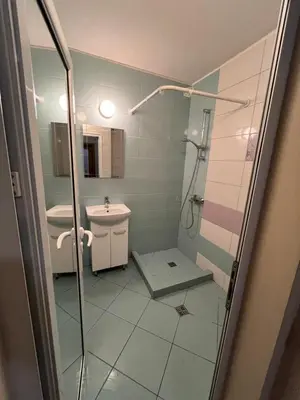 a bathroom with a shower and a sink at Уютен тристаен апаратамент,намиращ се на тиха и спокойна улица in Sofia