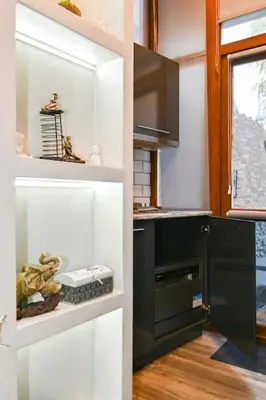 a kitchen with a black and white refrigerator at Velar 1BDR Apartment in Sofia