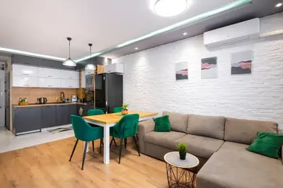 a living room with a couch and a table at Feel Right at Home - Bright and Modern Apartment by Flat Mаnager in Sofia