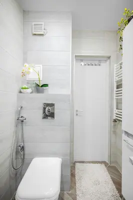 a bathroom with a toilet and a white door at Feel Right at Home - Bright and Modern Apartment by Flat Mаnager in Sofia