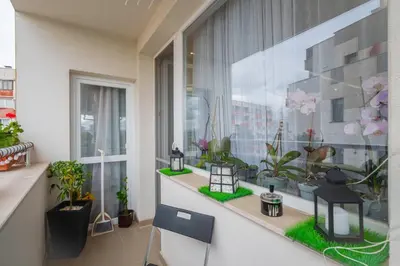 a balcony with potted plants and a window at Feel Right at Home - Bright and Modern Apartment by Flat Mаnager in Sofia