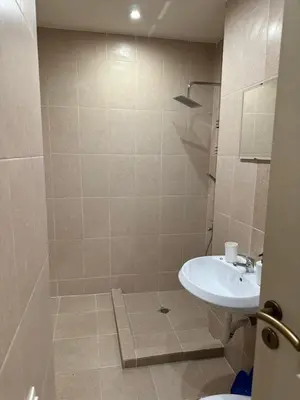 a bathroom with a sink and a toilet at Simple and Affordable Apartment in Bansko with available parking space in Bansko