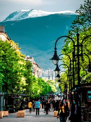 a group of people walking down a city street at Central Apartment 2 in Sofia