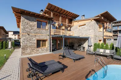 a house with a deck with a swimming pool at Aqua Thermal Villa Banya in Banya