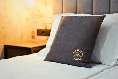 a pillow sitting on top of a bed at AGIA- luxury apartment Sofia in Sofia