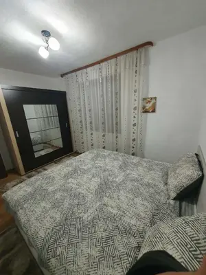 a bedroom with a large bed and a window at Levkov in Petrich