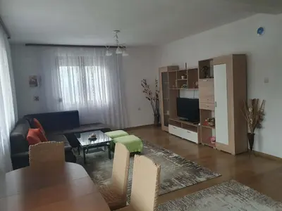 a living room with a couch and a table at Levkov in Petrich