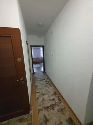 an empty room with a door and a hallway at Levkov in Petrich
