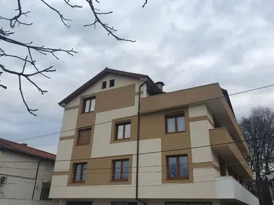 a tall building with windows on top of it at Levkov in Petrich