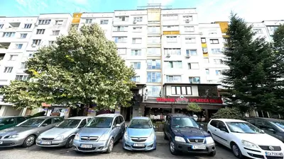 a row of cars parked in front of a building at AGIA 2 - cozy one room apartment in Sofia