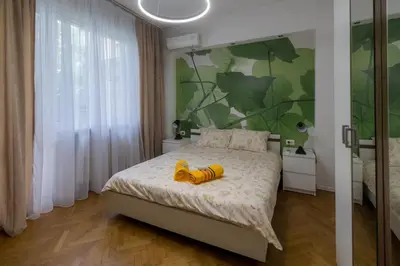 a bedroom with a bed with a stuffed animal on it at 7 Seconds Away From the Main Street, FREE Parking in Sofia