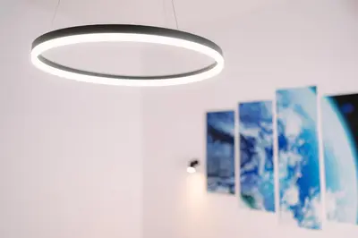 a ceiling light in a room with pictures at 7 Seconds Away From the Main Street, FREE Parking in Sofia