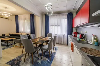 a kitchen and living room with a table and chairs at 7 Seconds Away From the Main Street, FREE Parking in Sofia