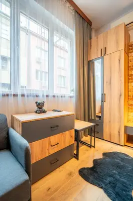 a living room with a couch and a table at BB Apartment in Sofia