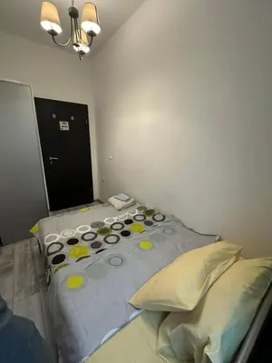 a bedroom with two beds with pillows at Comfort Guest Rooms in Plovdiv