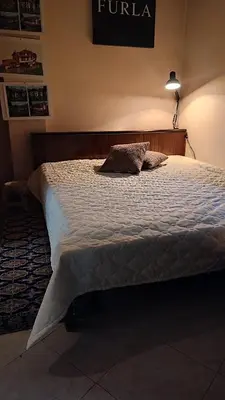 a bedroom with a large bed with a pillow on it at Apartments in Ramada 2 Complex in Bansko