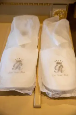 two white towels with a knife on a table at Luxury Apartment Rich 3 in Velingrad