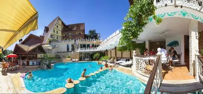 a large swimming pool with people in a resort at Luxury Apartment Rich 3 in Velingrad