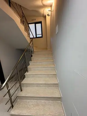 a stairway in a building with a stair case at Hotel Avalon Kyustendil in Kyustendil
