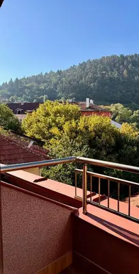 a balcony of a building with a view of trees at Hotel Avalon Kyustendil in Kyustendil