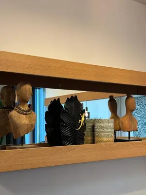 a wooden shelf with figurines on top of it at Sofia Rooftop Red Apple in Sofia