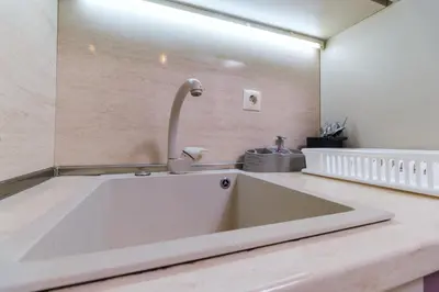 a large sink with a faucet on a counter at Riverside 2-Bedroom Apartment in Plovdiv