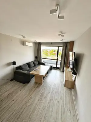 a living room with a couch and a table at Central Apartment with Amazing Views in Sofia