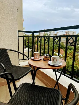 two cups of coffee on a table on a balcony at Grace Appartament in Plovdiv