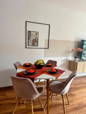 a dining room with a table and chairs at Grace Appartament in Plovdiv