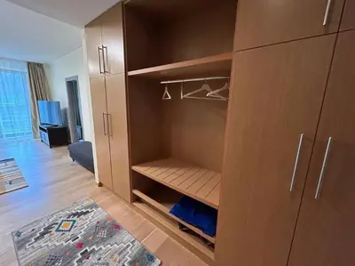 a large wooden cabinet in a living room at Silent retreat at Euphoria Club and SPA Borovets in Borovets