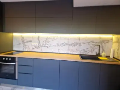 a kitchen with a marble counter top and a sink at Daisy Garden by the Church in Razlog