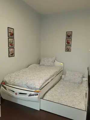 a bedroom with two bunk beds in a wall at Family Suite in Sofia