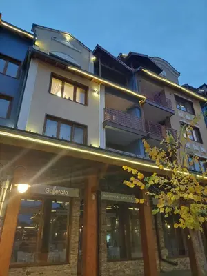 a building with a store front with a building at Bansko Pirin Golf & Country Club Blue Mountains View in Razlog