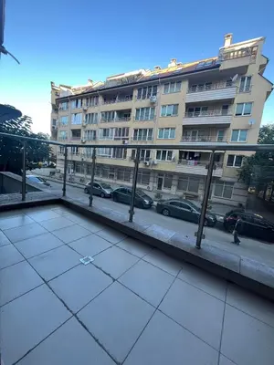 a large building with cars parked in front of it at Studio 108 by COSHER in Sofia