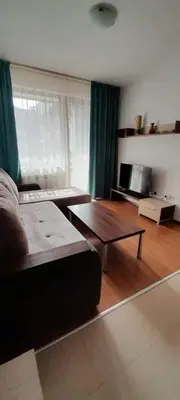 a living room with a couch and a coffee table at Apartments Belvedere B303 in Bansko
