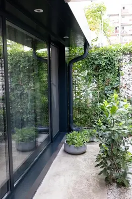 a room with plants in pots next to a window at Luxury studio 12-4 in Plovdiv