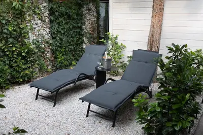a group of four chairs and a table at Luxury studio 12-4 in Plovdiv